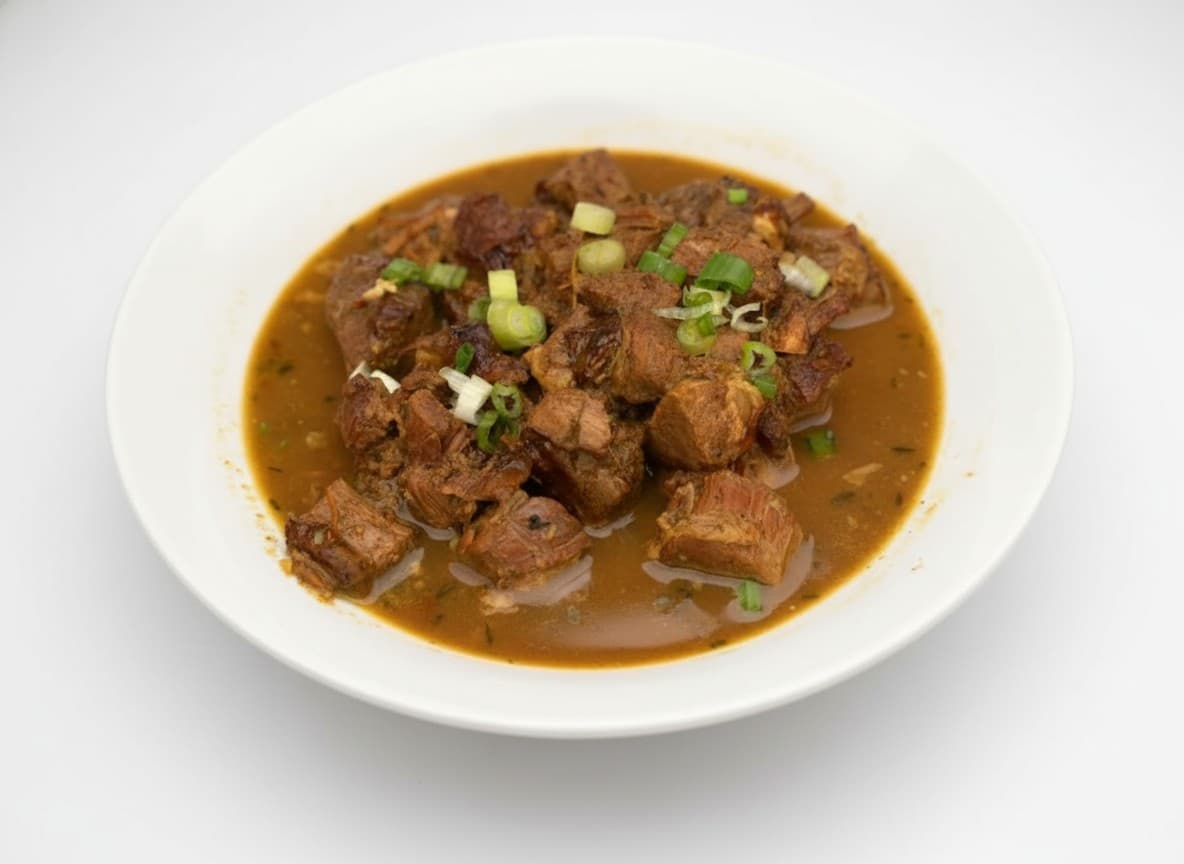 Curry goat and roti at Bamboo Fire Cafe in Delray Beach