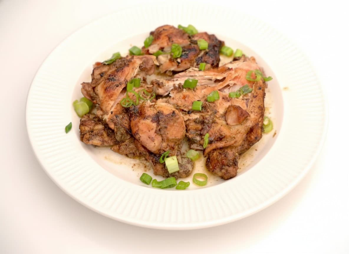 Jerk chicken plate with rice and plantains at Bamboo Fire Cafe in Delray Beach